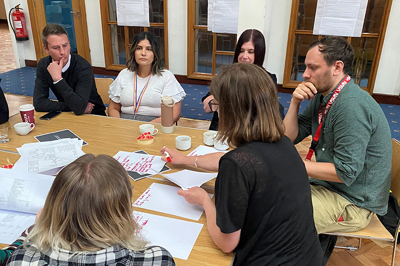 Group of people round a table at a business meeting
